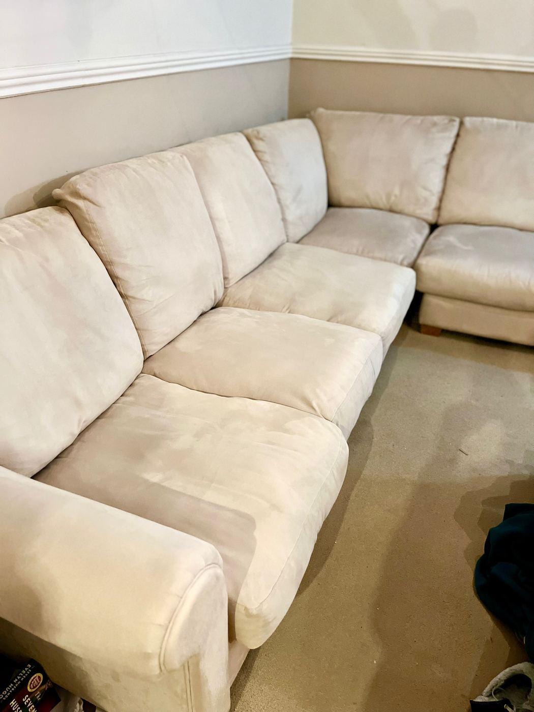 The same corner suite after cleaning, the cushions back to their original pale cream