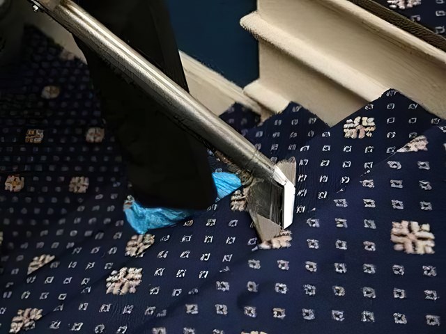 Patterned stair carpet being cleaned